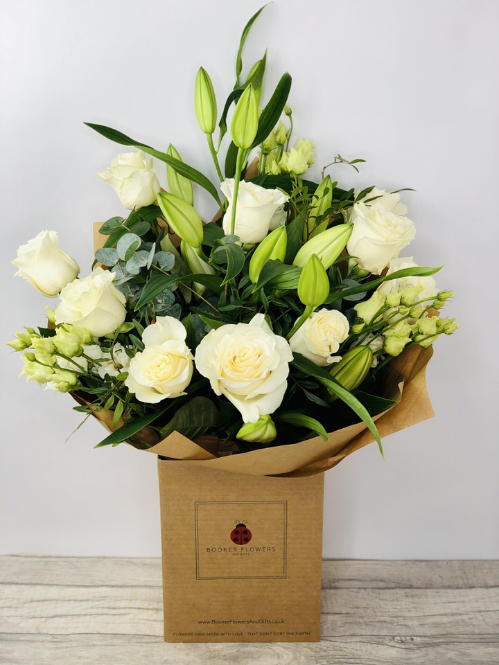 <h2>Beautiful White Celebration Bouquet - Hand-Delivered</h2>
<br>
<ul>
<li>Approximate Dimensions: 50cm x 40cm</li>
<li>Flowers arranged by hand and gift wrapped in our signature eco-friendly packaging and finished off with a hidden wooden ladybird</li>
<li>To give you the best occasionally we may make substitutes</li>
<li>Our flowers backed by our 7 days freshness guarantee</li>
<li>For delivery area coverage see below</li>
</ul>
<br>
<h2>Flower Delivery Coverage</h2>
<p>Our shop delivers flowers to the following Liverpool postcodes L1 L2 L3 L4 L5 L6 L7 L8 L11 L12 L13 L14 L15 L16 L17 L18 L19 L24 L25 L26 L27 L36 L70 If your order is for an area outside of these we can organise delivery for you through our network of florists. We will ask them to make as close as possible to the image but because of the difference in stock and sundry items it may not be exact.</p>
<br>
<h2>Hand-tied Bouquet | Flowers in box with water</h2>
<p>These beautiful flowers hand-arranged by our professional florists into a hand-tied bouquet are a delightful choice from our new collection. This white bouquet would make the perfect gift to celebrate any occasion.</p>
<p>Handtied bouquets are a lovely display of fresh flowers that have the wow factor. The advantage of having a bouquet made this way is that they are artfully arranged by our florists and tied so that they stay in the display.</p>
<p>They are then gift wrapped and aqua packed in a water bubble so that at no point are the flowers out of water. This means they look their very best on the day they arrive and continue to delight for days after.</p>
<p>Being delivered in a transporter box and in water means the recipient does not need to put the flowers in a vase straight away they can just put them down and enjoy.</p>
<p>Featuring 2 white oriental, 8 white roses, and 3 white lisianthus, together with mixed seasonal foliage including eucalyptus.</p>
<br>
<h2>Eco-Friendly Liverpool Florists</h2>
<p>As florists we feel very close earth and want to protect it. Plastic waste is a huge problem in the florist industry so we made the decision to make our packaging eco-friendly.</p>
<p>To achieve this we worked with our packaging supplier to remove the lamination off our boxes and wrap the tops in an Eco Flowerwrap which means it easily compostable or can be fully recycled.</p>
<p>Once you have finished enjoying your flowers from us they will go back into growing more flowers! Only a small amount of plastic is used as a water bubble and this is biodegradable.</p>
<p>Even the sachet of flower food included with your bouquet is compostable.</p>
<p>All our bouquets have small wooden ladybird hidden amongst them so do not forget to spot the ladybird and post a picture on our social media pages to enter our rolling competition.</p>
<br>
<h2>Flowers Guaranteed for 7 Days</h2>
<p>Our 7-day freshness guarantee should give you confidence that we will only send out good quality flowers.</p>
<p>Leave it in our hands we will create a marvellous bouquet which will not only look good on arrival but will continue to delight as the flowers bloom.</p>
<br>
<h2>Liverpool Flower Delivery</h2>
<p>We are open 7 days a week and offer advanced booking flower delivery same-day flower delivery 3-hour flower delivery. Guaranteed AM PM or Evening Flower Delivery and also offer Sunday Flower Delivery.</p>
<p>Our florists deliver in Liverpool and can provide flowers for you in Liverpool Merseyside. And through our network of florists can organise flower deliveries for you nationwide.</p>
<br>
<h2>The Best Florist in Liverpool your local Liverpool Flower Shop</h2>
<p>Come to Booker Flowers and Gifts Liverpool for your beautiful flowers and plants. For that bit of extra luxury we also offer a lovely range of finishing touches such as wines champagne locally crafted Gin and Rum Vases Scented Candles and Chocolates that can be delivered with your flowers.</p>
<p>To see the full range see our extras section.</p>
<p>You can trust Booker Flowers and Gifts of delivery the very best for you.</p>
<p><br /><br /></p>
<p><em>5 Star review on Yell.com</em></p>
<br>
<p><em>Thank you Gemma for your fabulous service. The flowers are of the highest quality and delivered with a warm smile. My sister was delighted. Ordering was simple and the communications were top-notch. I will definitely use your services again.</em></p>